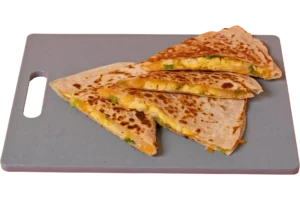 Four toasted quesadilla triangles filled with scrambled eggs, melted cheese, and green onions on a gray cutting board.