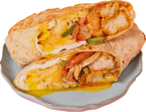 Two halves of a toasted burrito stacked on a plate, showing melted cheese, eggs, peppers, and crispy fillings.