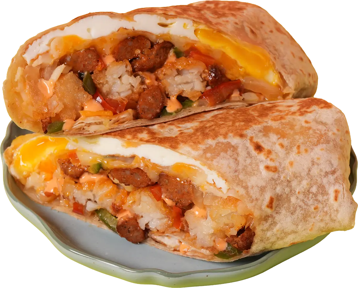 Cut breakfast burrito with fried eggs, bacon or spicy sausage, house blend cheese, and breakfast tots in a 12-inch flour wrap.